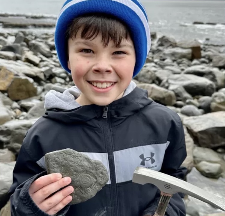Nine-Year-Old Welsh Boy Finds 200-Million-Year-Old Ammonite Fossil in Beach Cliff